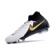 Bota Nike Phantom Luna II Elite FG Blanco Negro Mtlc Dorado Moneda