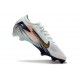 Bota Nike Zoom Mercurial Vapor XVI Elite FG MDS Casi Verde Dorado metalizado Moneda